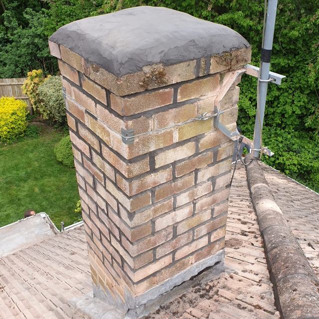 Chimney with a new mortar top (flaunching)