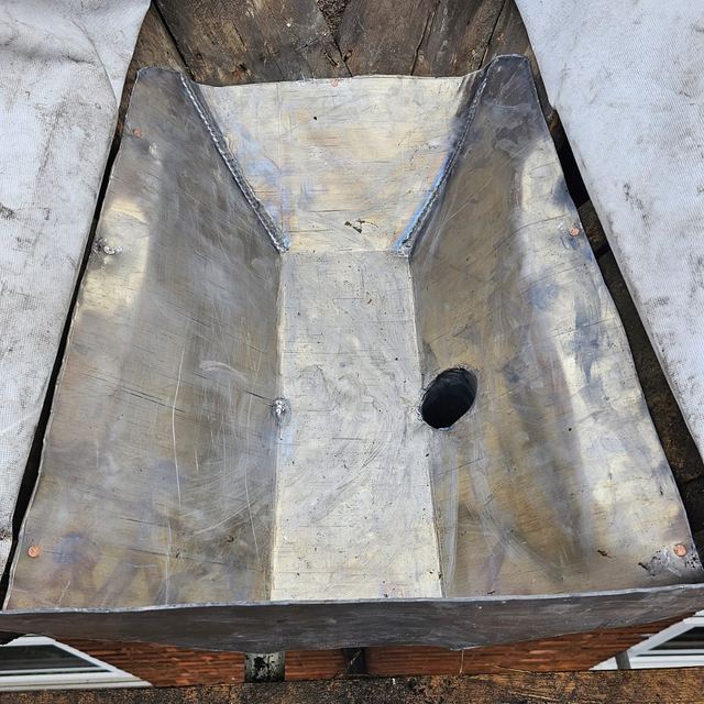 New lead-lined gutter behind a chimney