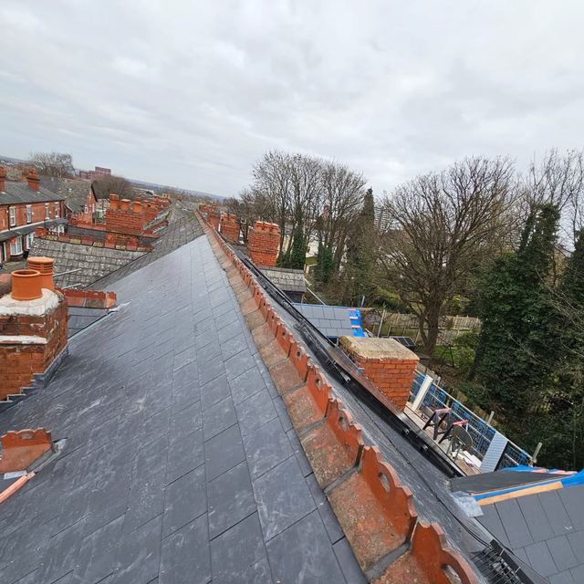 New slate roof along a row of terraced houses
