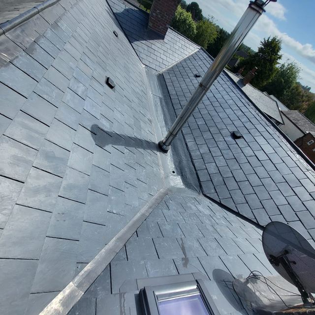 Slate roof with lead valleys and a new roof window