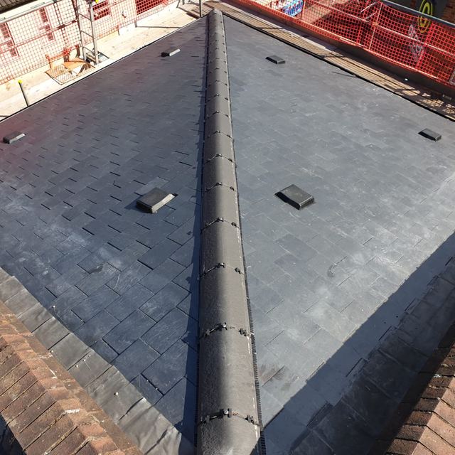 New slate roof with a dry-fixed ridge